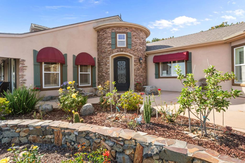 Stone turret entry and rose garden at the front door