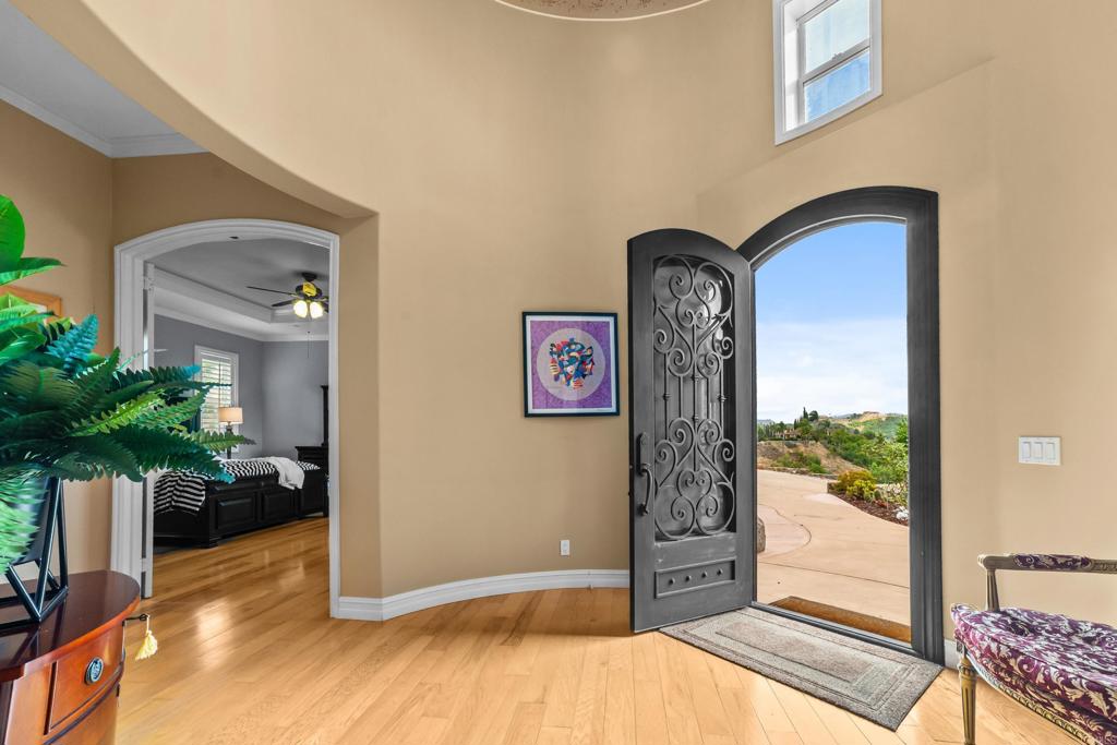 Open great room with high ceilings and hardwood floors at 30419 Canyon Estates Road