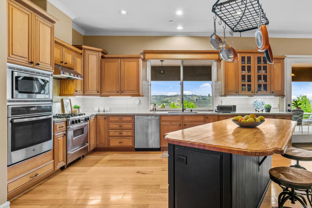 Chef's kitchen with double ovens, six burner range and granite counters